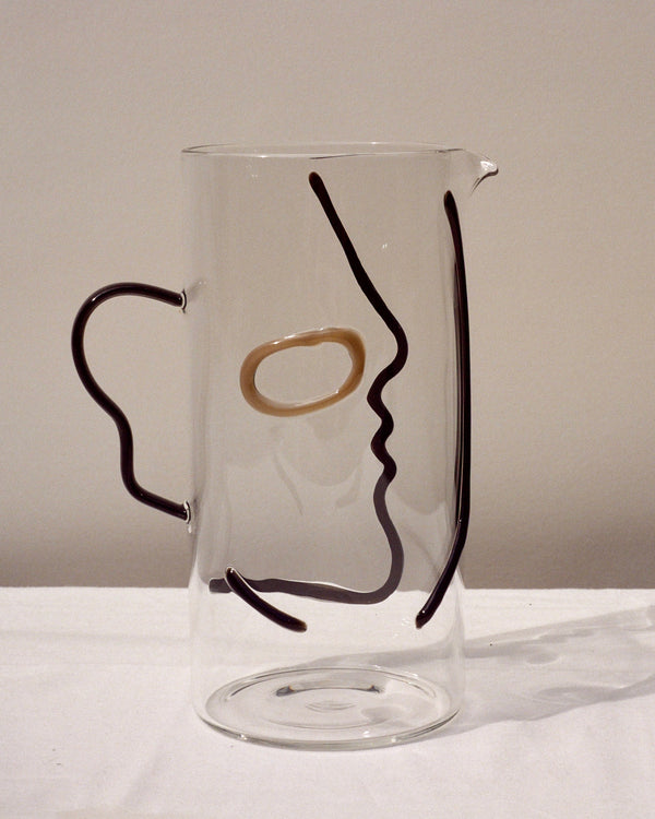 La Danse clear pitcher with face silhouette